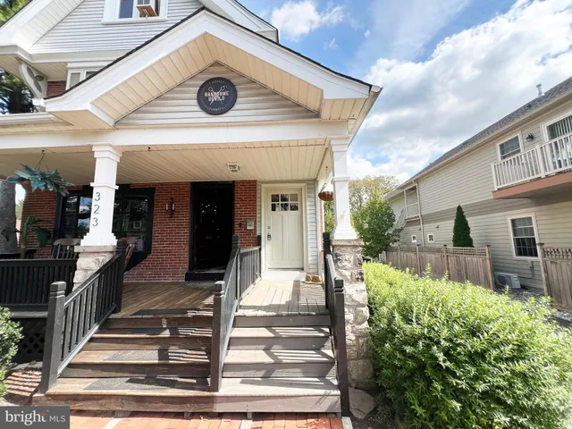 a front view of a house with a porch