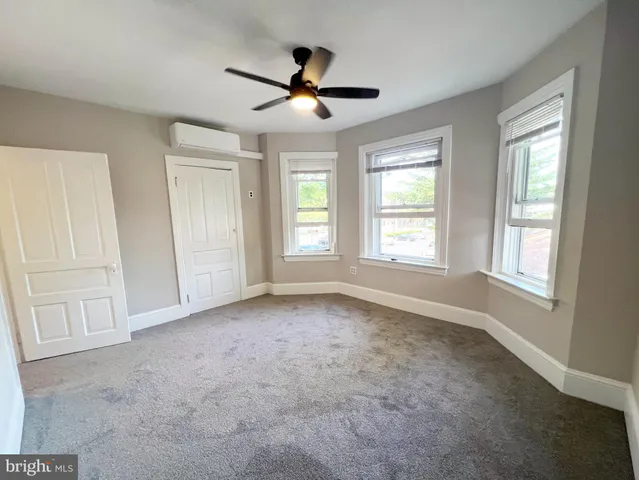 a view of an empty room with a window