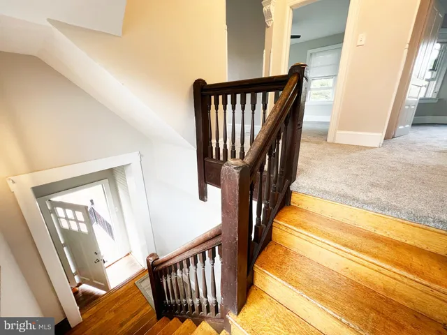 a view of stairs and wooden floor