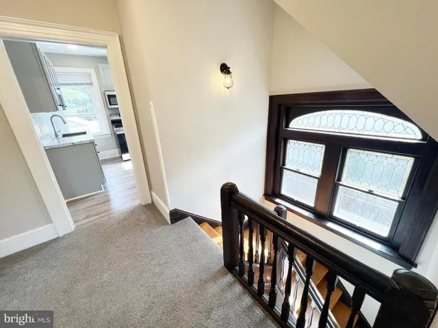 a view of an entryway with a staircase