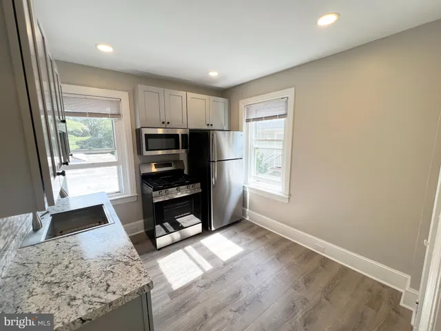 a view of a livingroom with furniture and a window