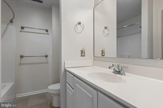 a bathroom with a sink toilet and vanity