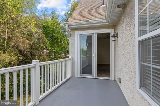 a view of a brick house with a porch