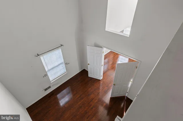 a view of an entryway with wooden floor