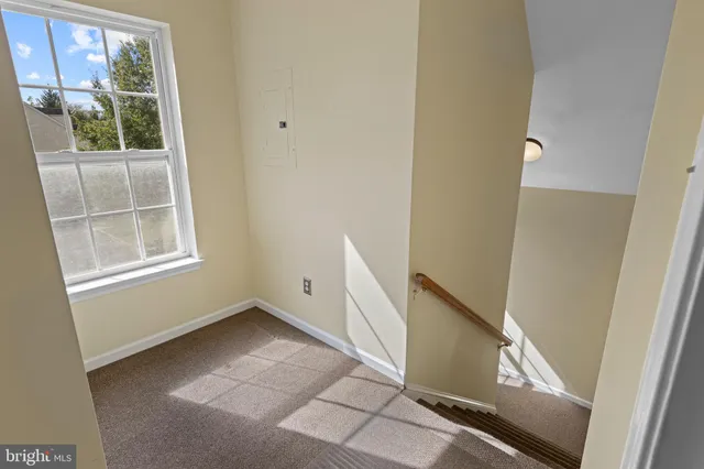 a view of an empty room with windows