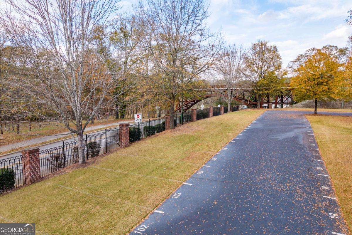 225 Oak Street, Unit 104 Athens, GA 30601 - Photo 12 of 27 a view of swimming pool with trees in front of house