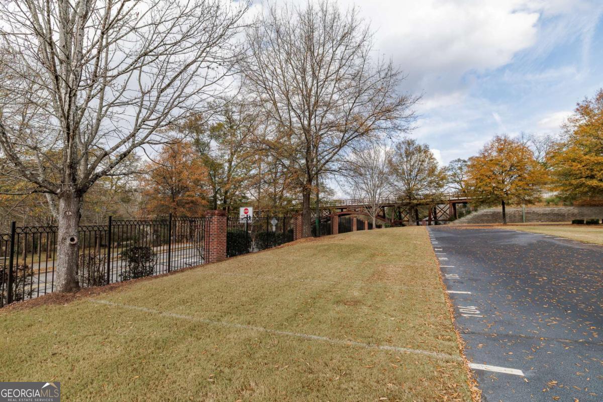 225 Oak Street, Unit 104 Athens, GA 30601 - Photo 17 of 27 a view of road and trees
