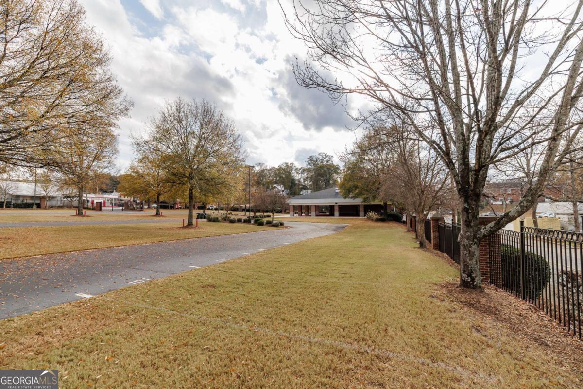 225 Oak Street, Unit 104 Athens, GA 30601 - Photo 18 of 27 a view of outdoor space with swimming pool and trees