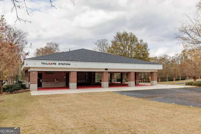 a view of a porch with furniture and a yard