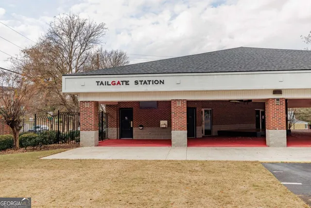a view of a livingroom with furniture and staircase