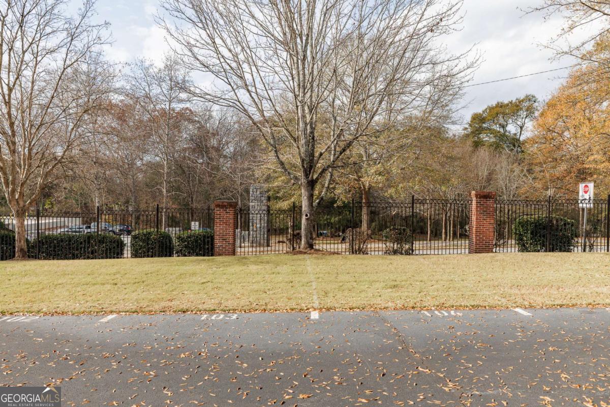 225 Oak Street, Unit 104 Athens, GA 30601 - Photo 22 of 27 a view of a house with a yard covered with snow