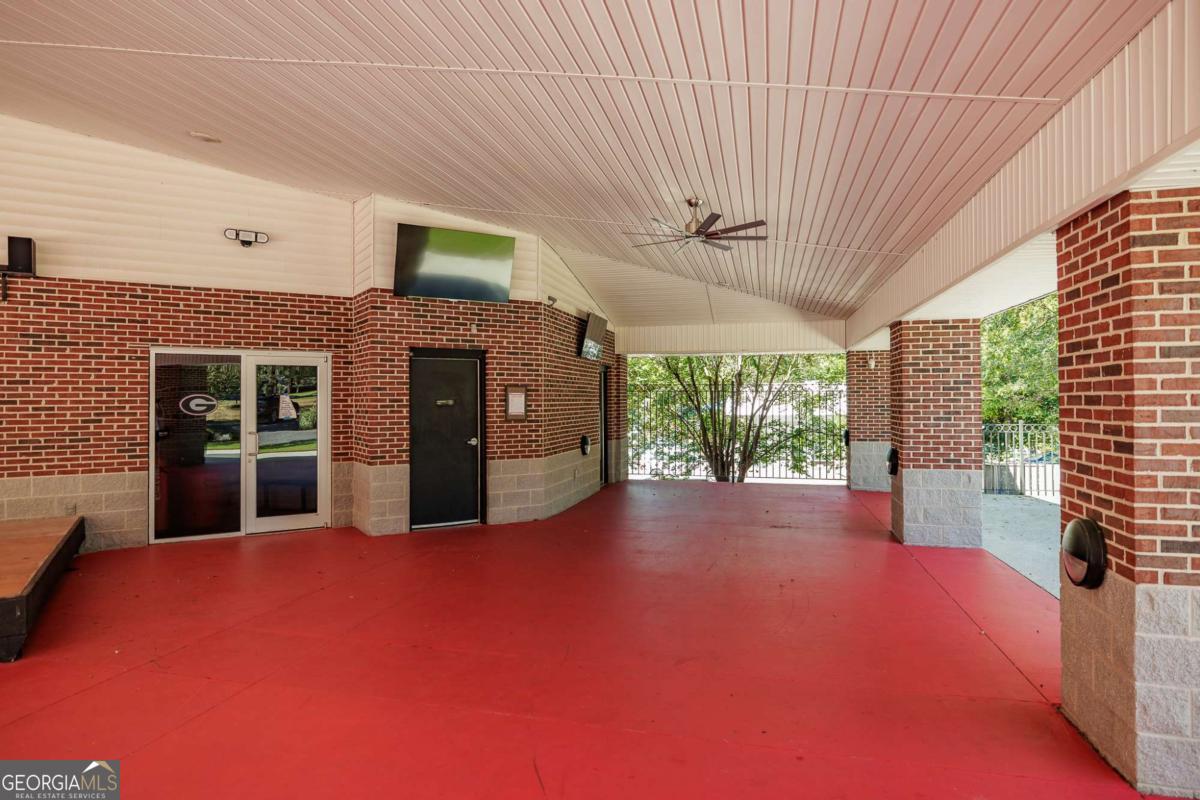 225 Oak Street, Unit 104 Athens, GA 30601 - Photo 26 of 27 a view of a livingroom with an empty space and a fireplace