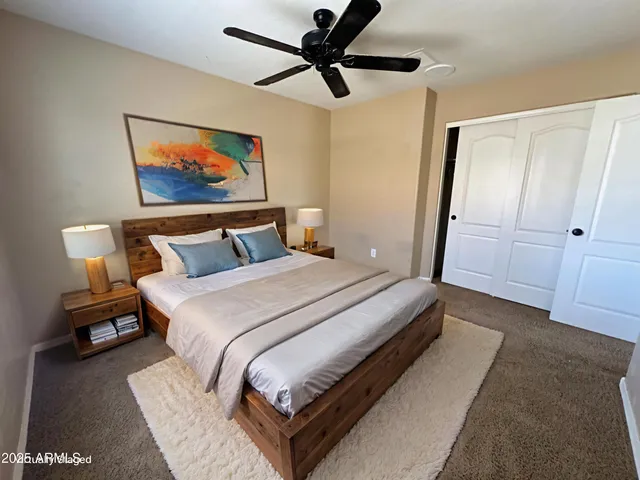 a bedroom with a bed and a window