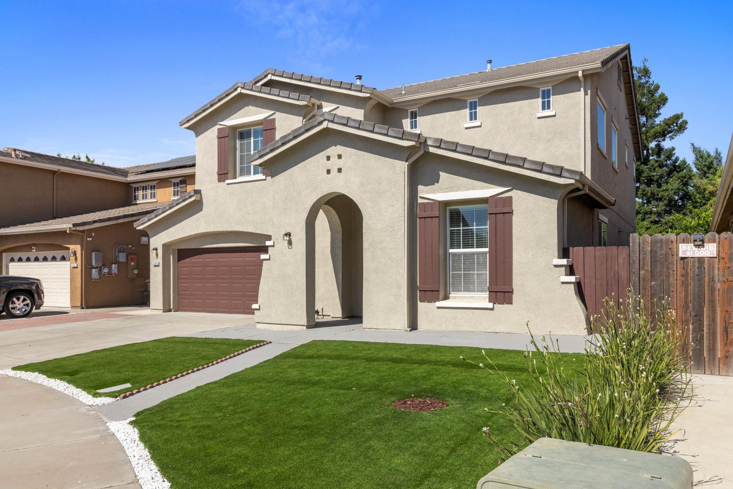 3105 Ripple Court Modesto, CA 95355 - Photo 3 of 46 a front view of a house with a yard