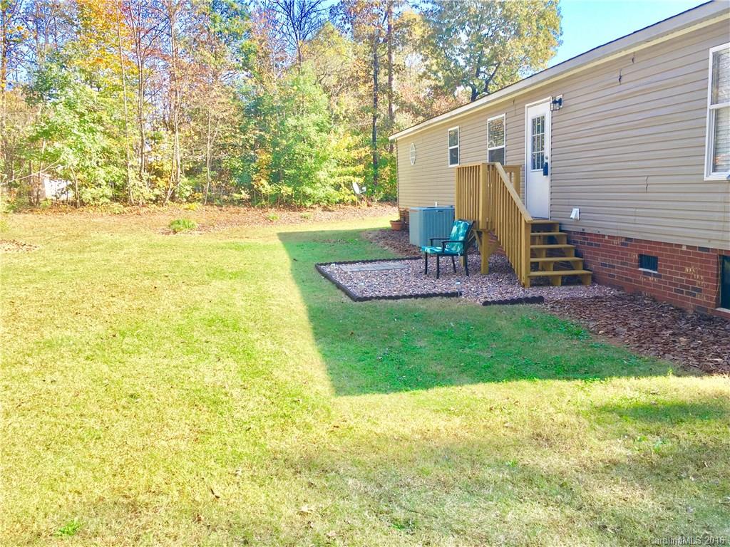 119 Forney Road, Unit 1 Olin, NC 28660 - Photo 15 of 17 a view of a house with backyard and sitting area