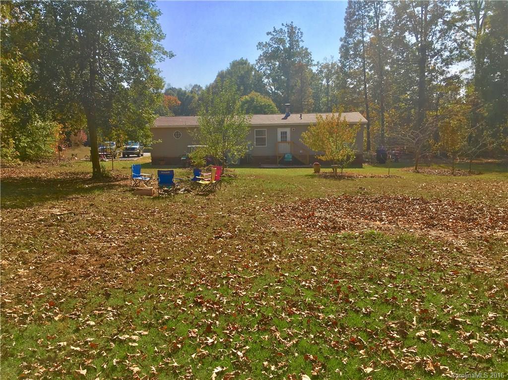 119 Forney Road, Unit 1 Olin, NC 28660 - Photo 16 of 17 a backyard of a house with table and chairs