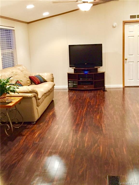 119 Forney Road, Unit 1 Olin, NC 28660 - Photo 3 of 17 a living room with furniture and a flat screen tv