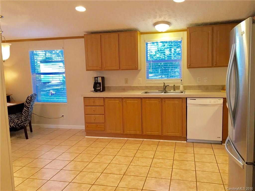 119 Forney Road, Unit 1 Olin, NC 28660 - Photo 6 of 17 a kitchen with a cabinets a sink and a counter top space