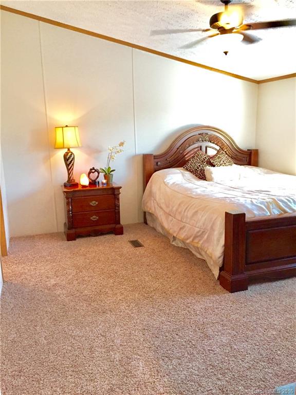 119 Forney Road, Unit 1 Olin, NC 28660 - Photo 8 of 17 a bedroom with a bed and window