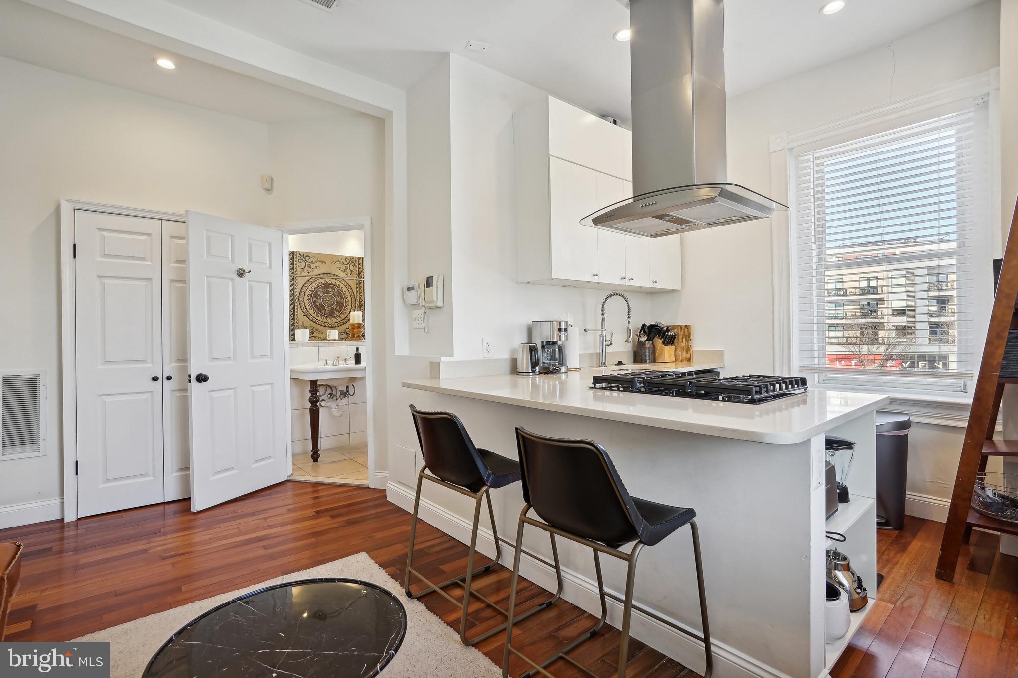 1101 P Street Northwest Washington, DC 20005 - Photo 28 of 50 Open kitchen with gas cooktop and hood