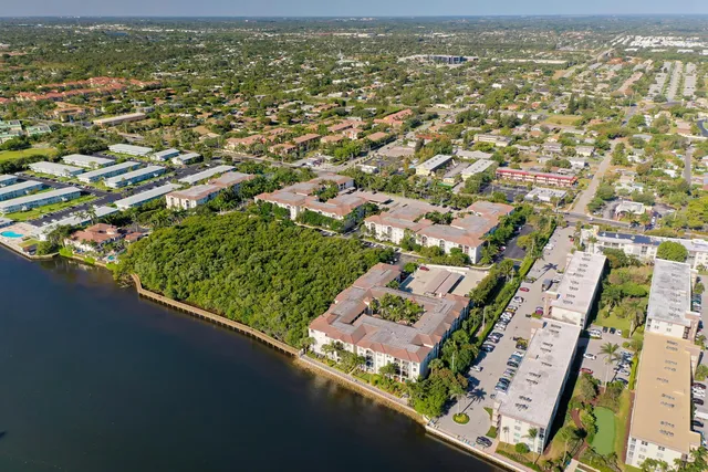 an aerial view of a house with a lake view