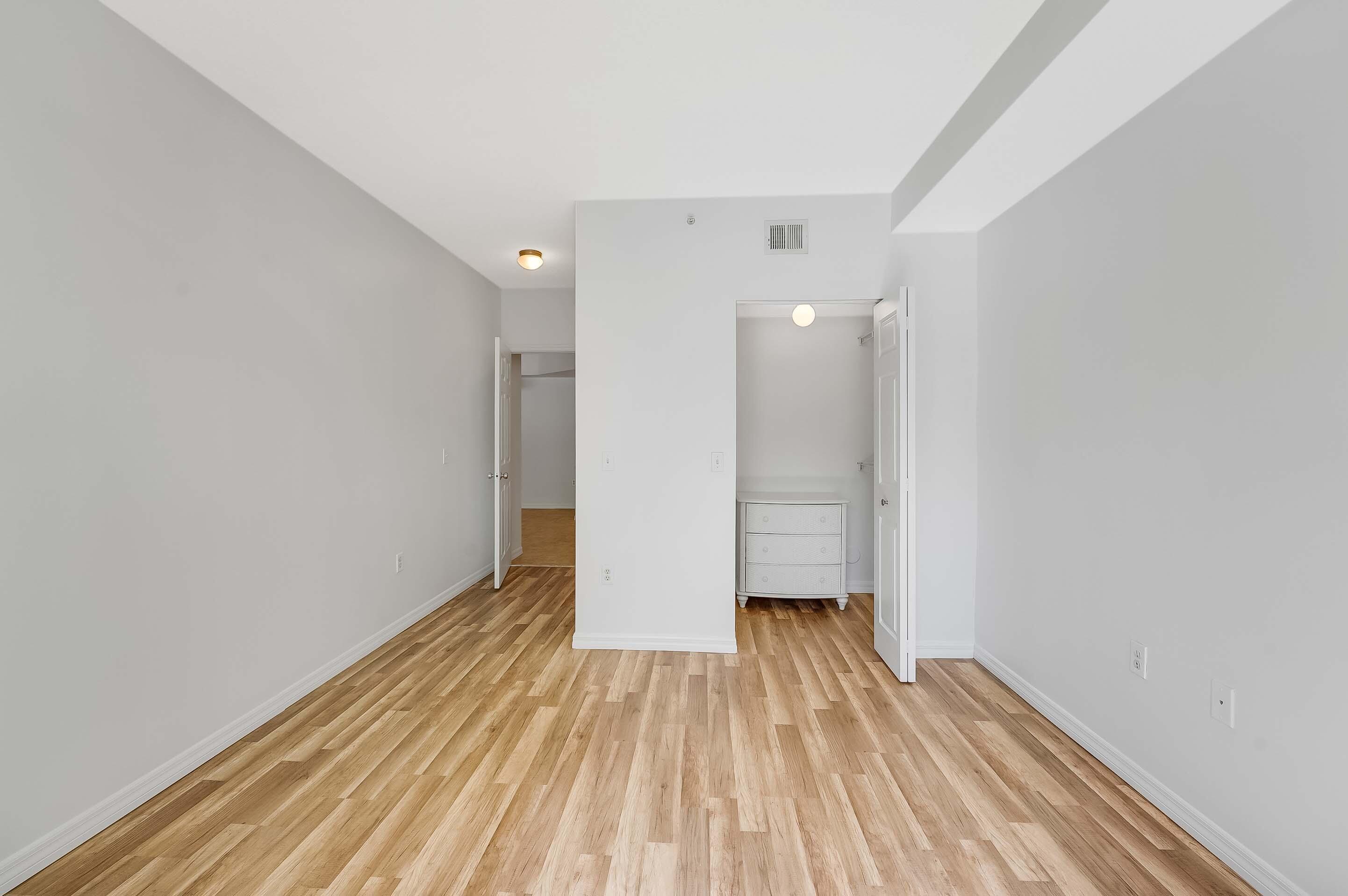 3115 Tuscany Way Boynton Beach, FL 33435 - Photo 28 of 49 a view of a room with wooden floor and a ceiling fan