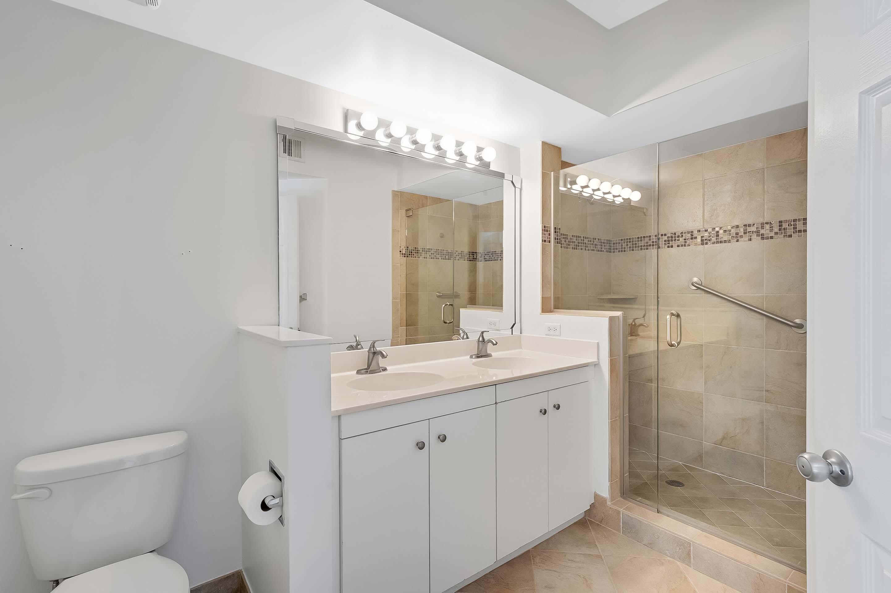 3115 Tuscany Way Boynton Beach, FL 33435 - Photo 32 of 49 a bathroom with a double vanity sink mirror and toilet