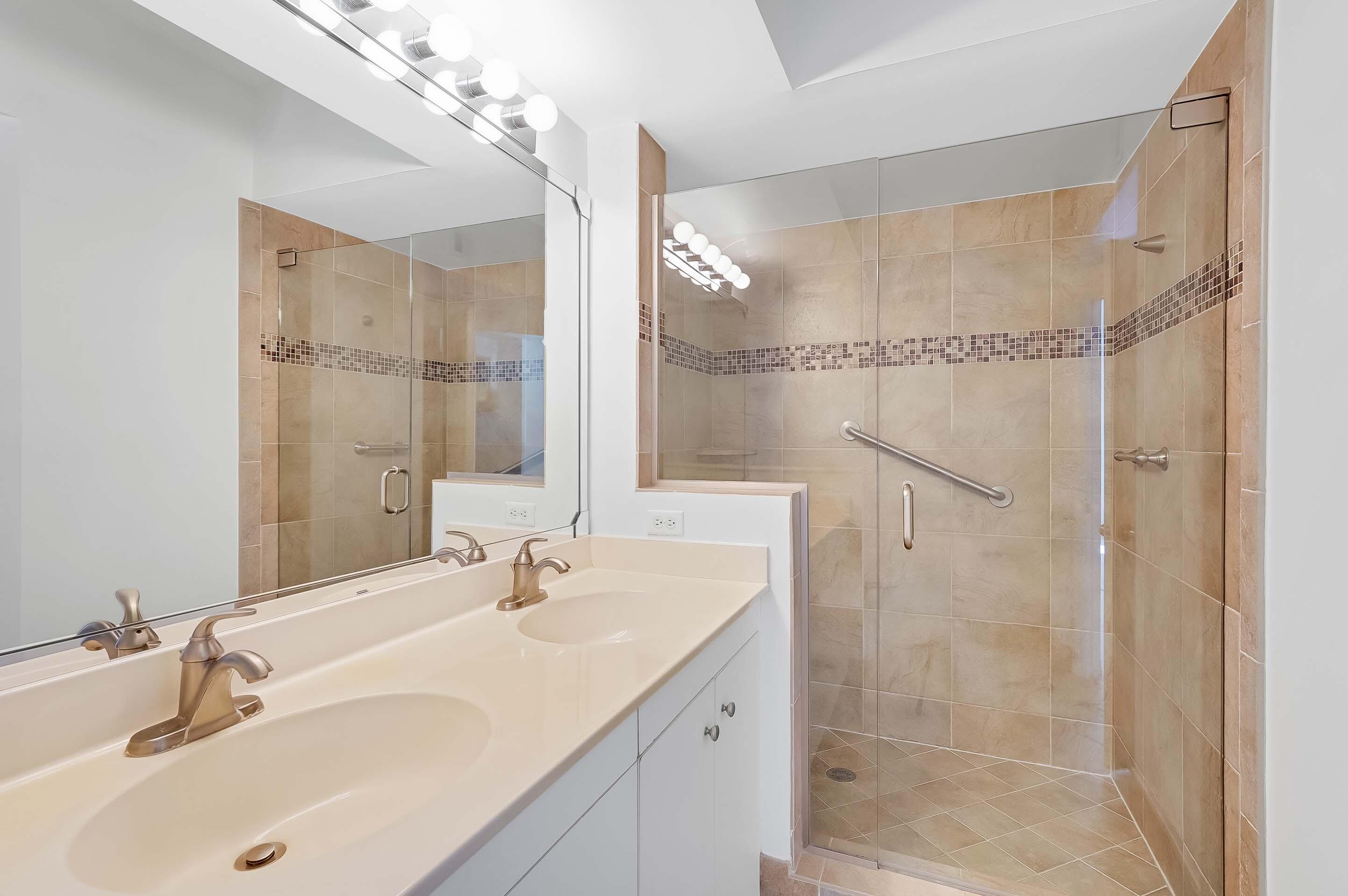 3115 Tuscany Way Boynton Beach, FL 33435 - Photo 33 of 49 a bathroom with a sink shower and a mirror