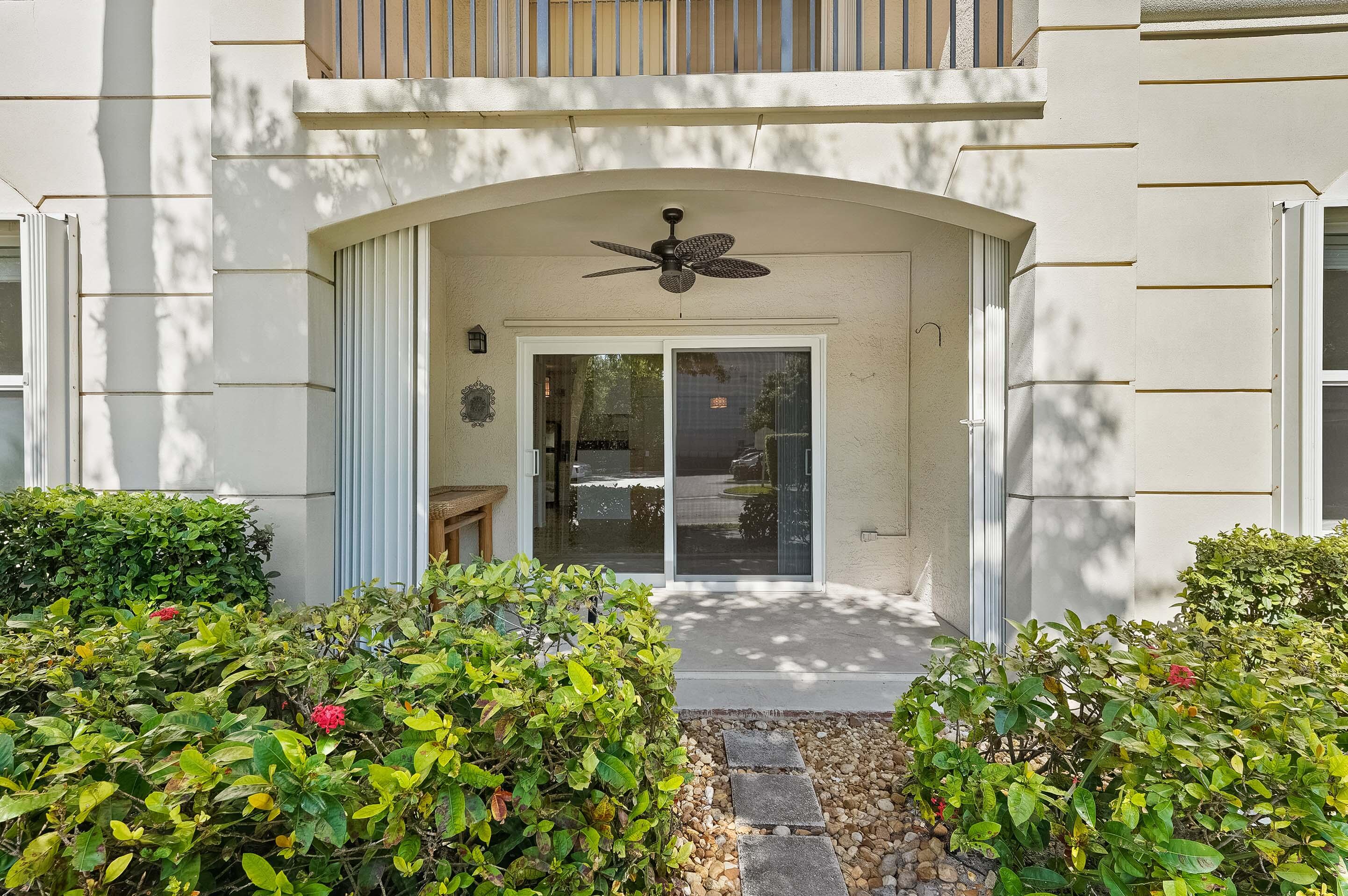 3115 Tuscany Way Boynton Beach, FL 33435 - Photo 41 of 49 a front view of a house with a yard