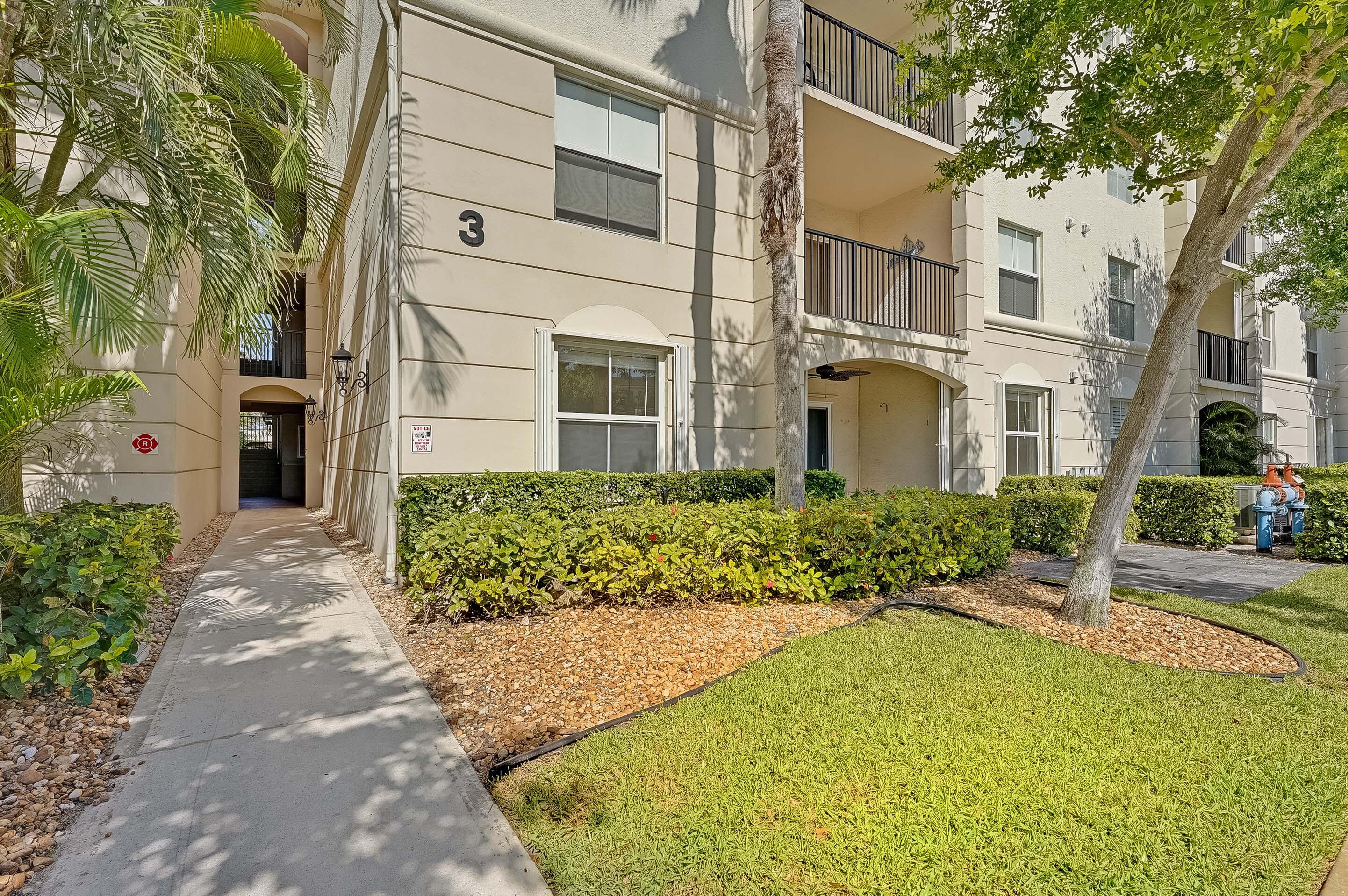 3115 Tuscany Way Boynton Beach, FL 33435 - Photo 42 of 49 a view of a white house with a large trees