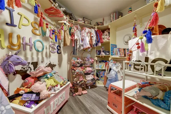 a bathroom with a granite countertop toilet and a sink