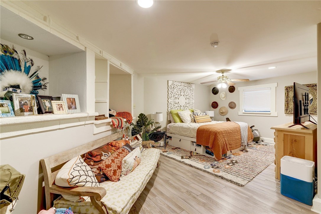 1712 Lakeshore Drive, Unit A Austin, TX 78746 - Photo 6 of 15 a living room with furniture and a fireplace