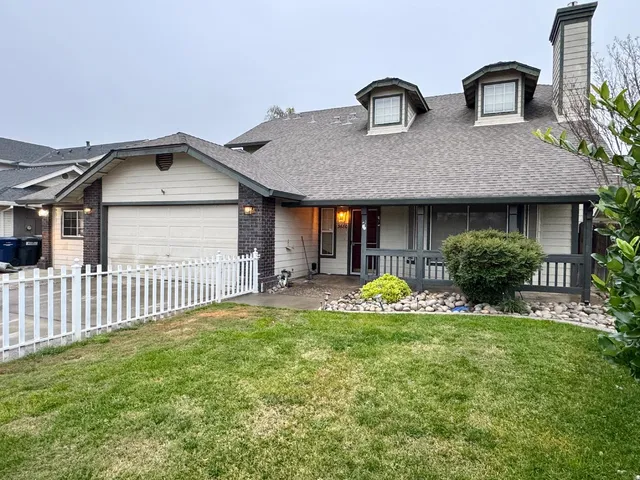 a front view of house with yard and porch