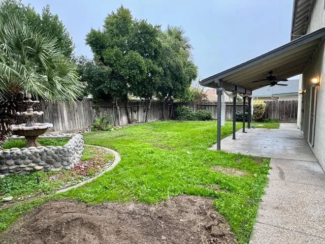 a backyard of a house with lots of green space