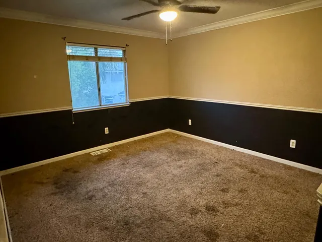 a view of an empty room and window