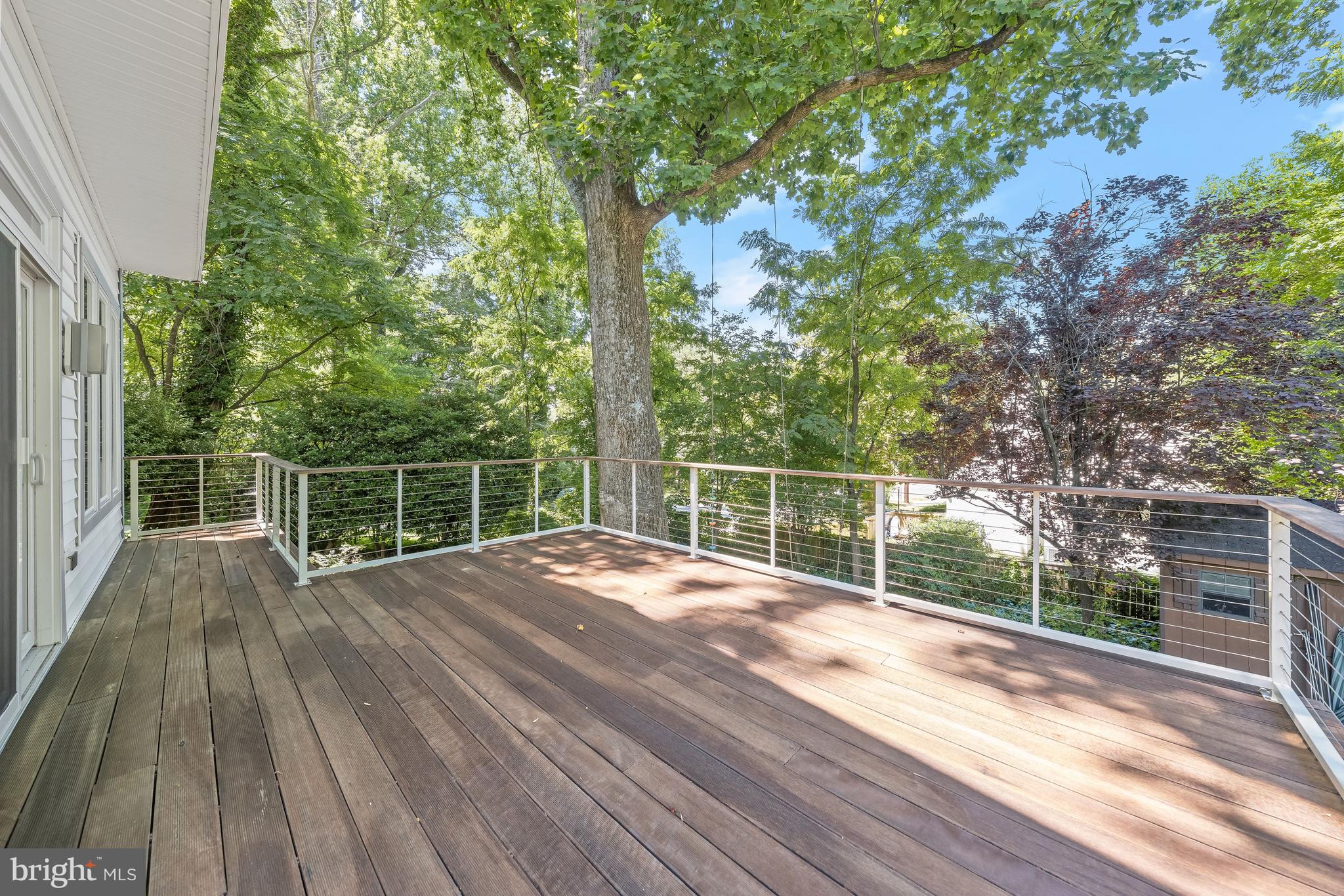 8800 Maywood Avenue Silver Spring, MD 20910 - Photo 10 of 41 a view of a deck with wooden floor and fence