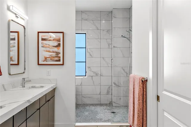 a bathroom with a bathtub and shower