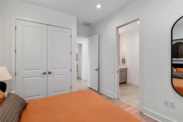 a bathroom with a double vanity sink and mirror