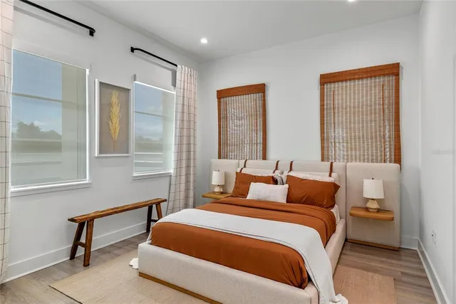 a bedroom with a bed and a window