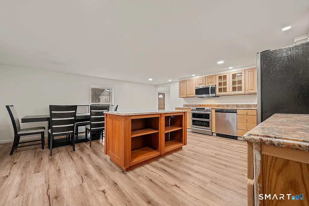 78 Union Street Bristol, CT 06010 - Photo 11 of 27 a open kitchen with stainless steel appliances granite countertop a stove and a refrigerator