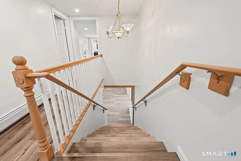 78 Union Street Bristol, CT 06010 - Photo 12 of 27 a view of entryway and hall with wooden floor