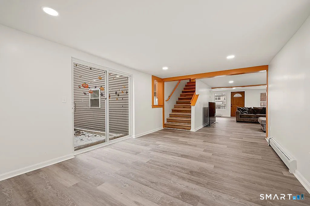 78 Union Street Bristol, CT 06010 - Photo 17 of 27 a view of a room with wooden floor and stairs