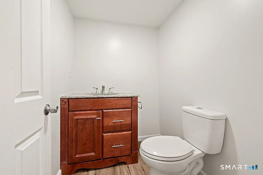 78 Union Street Bristol, CT 06010 - Photo 19 of 27 a bathroom with a toilet and a sink
