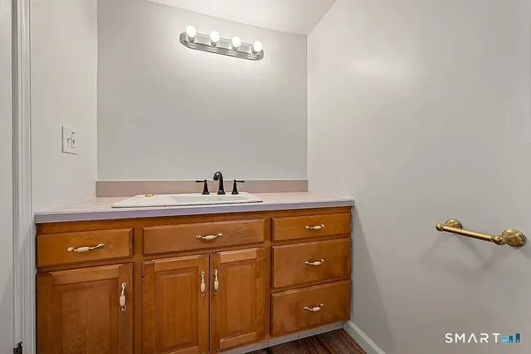 a bathroom with a sink and mirror