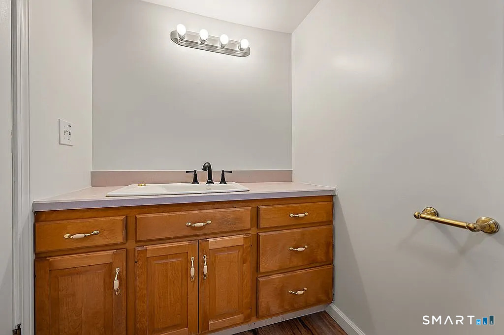 78 Union Street Bristol, CT 06010 - Photo 20 of 27 a bathroom with a sink and mirror