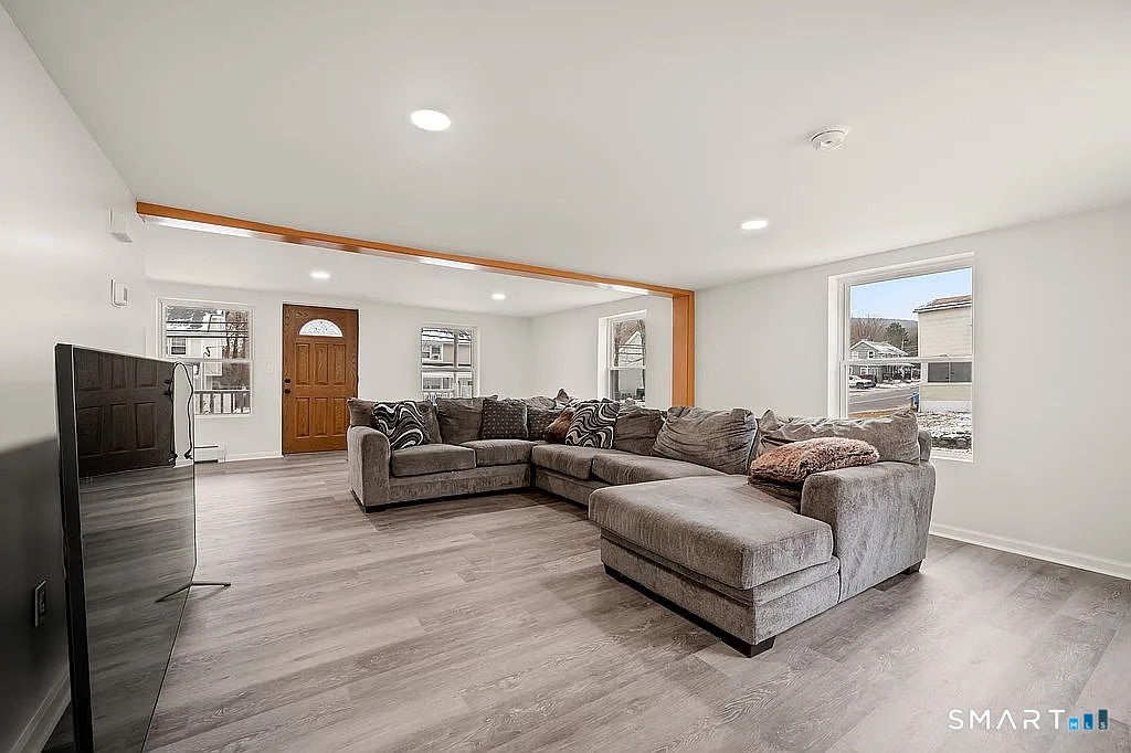 78 Union Street Bristol, CT 06010 - Photo 7 of 27 a living room with furniture and a flat screen tv