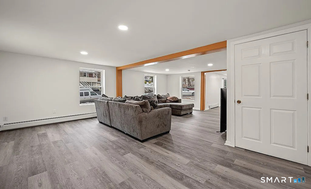 78 Union Street Bristol, CT 06010 - Photo 9 of 27 a living room with furniture and a wooden floor