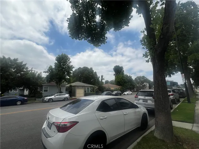 a view of a car parked in front of a house