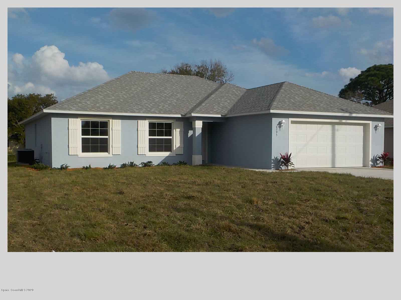6795 Haddington Road Cocoa, FL 32927 - Photo 18 of 18 a front view of house with yard