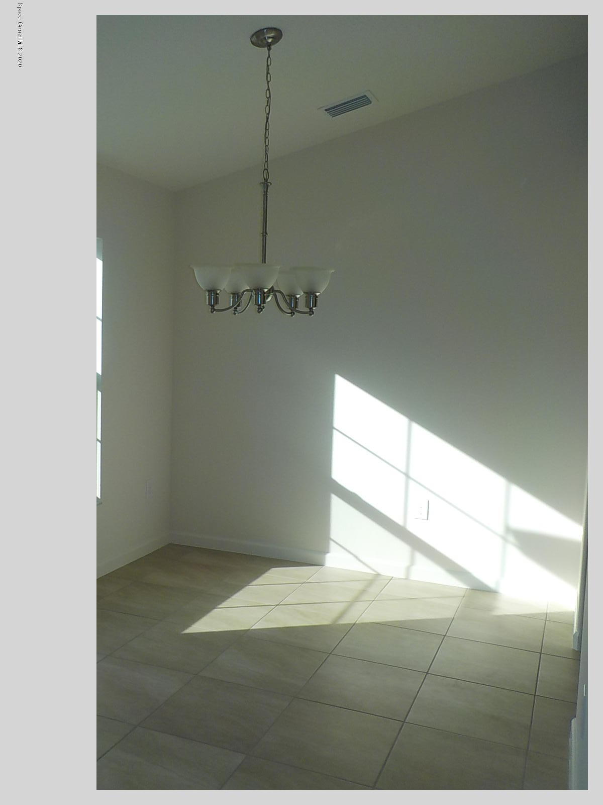 6795 Haddington Road Cocoa, FL 32927 - Photo 6 of 18 a view of empty room with window